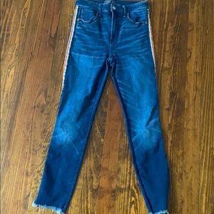 Blue jeans with stripes down side